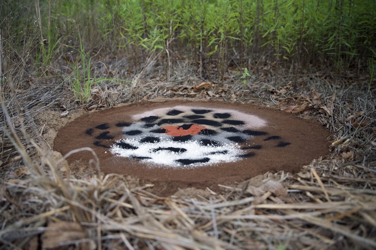 Powdered pigment made of blood meal, lime, charcoal, and red clay, 30 x 30 x 2 inches