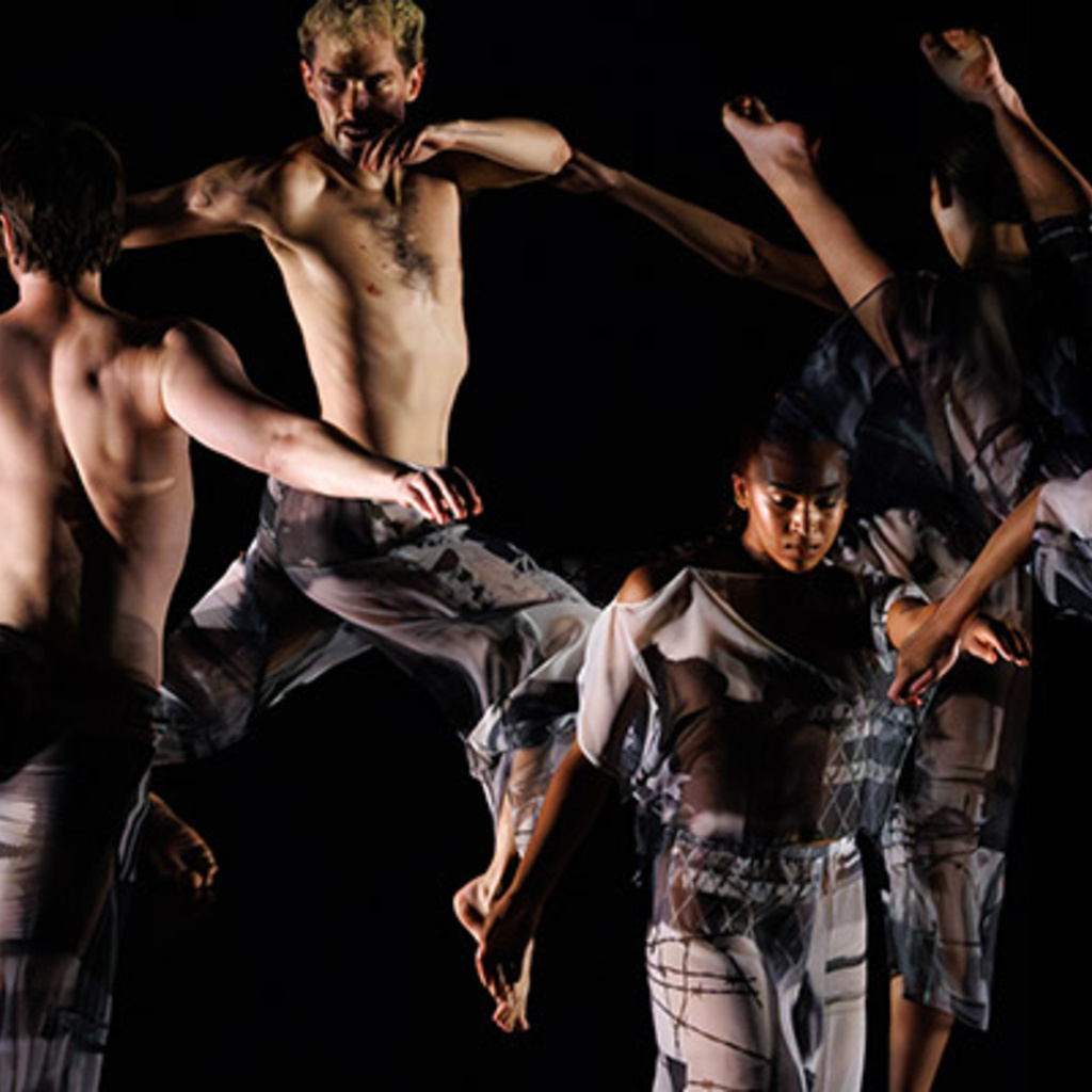 Six people in various positions wearing grey and black clothing