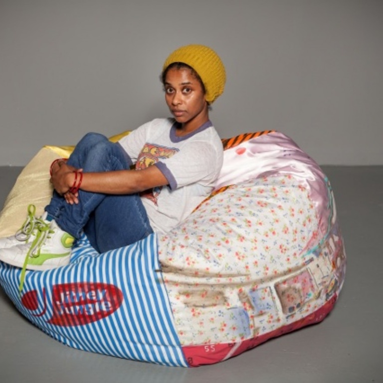 Dedeaux-Norris sits on a beanbag