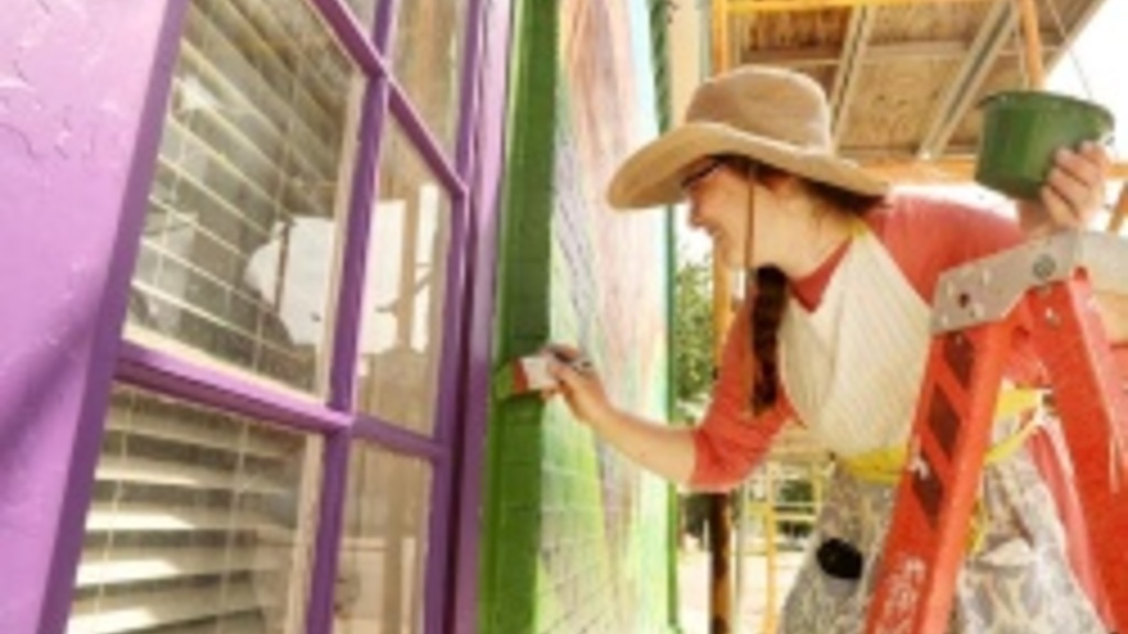 white woman paint on a wall
